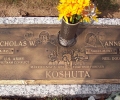 A TRIBUTE TO MR. & MRS. KOSHUTA PLACED ON A GRANITE FOUNDATION